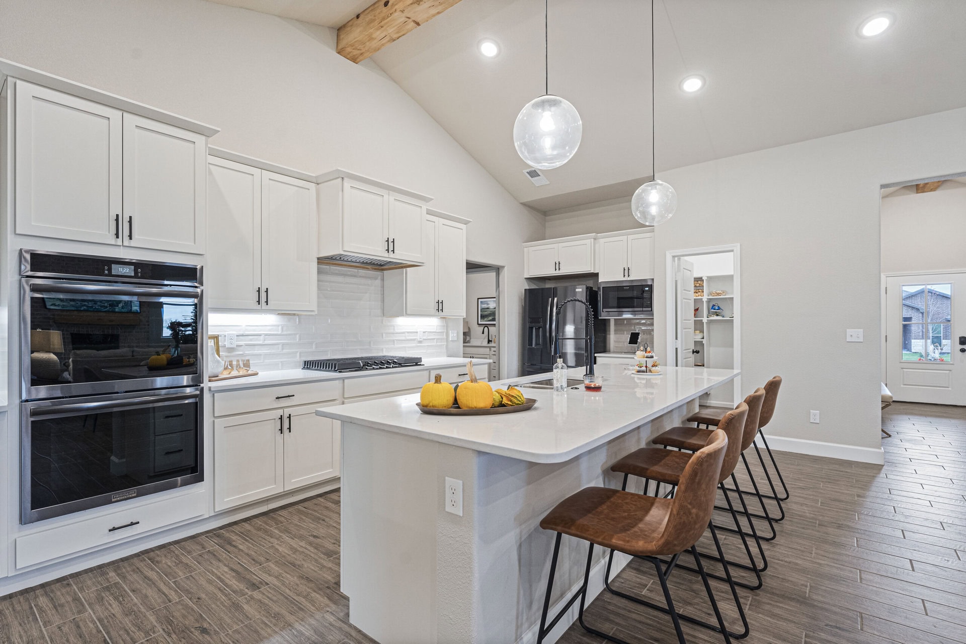 Penelope plan kitchen with large island and pendant lighting